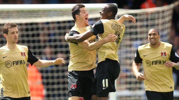 Moses Odubajo celebrates his equaliser with Leyton Orient teammate Lloyd James