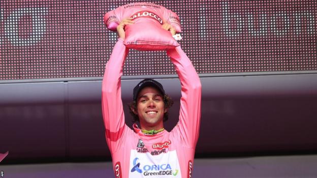 Australian Michael Matthews celebrates after taking the leader's pink jersey following the second stage of the Giro d'Italia in Belfast
