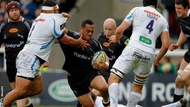 Sinoti Sinoti of Newcastle Falcons forces his way past Hoana Tui of Exeter Chiefs
