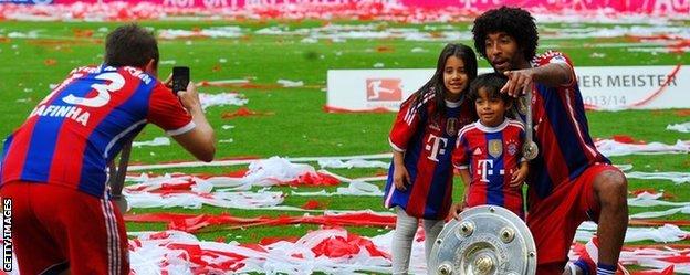 Bayern Munich players celebrate after their final league game of the season