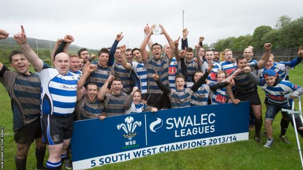 Ystradgynlais RFC players celebrate winning the SWALEC Division 5 South West title.