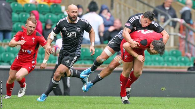 Adam Thomas is tackled during Wales’ pool match against New Zealand in the London leg of the IRB Sevens World Series at Twickenham.