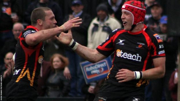 Tyler Morgan celebrates with team-mate Richie Rees after scoring Dragons' first try against Treviso.