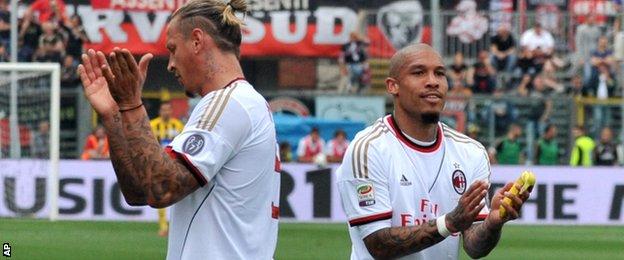 Philippe Mexes and Nigel de Jong of AC Milan