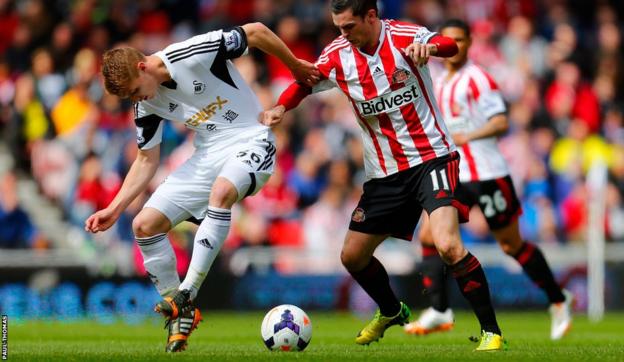 Jay Fulton, making his first start for Swansea City, gets stuck in with Sunderland’s Adam Johnson.