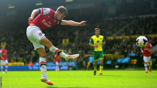 Aaron Ramsey scores with a spectacular volley to give Arsenal the lead against Norwich City at Carrow Road.