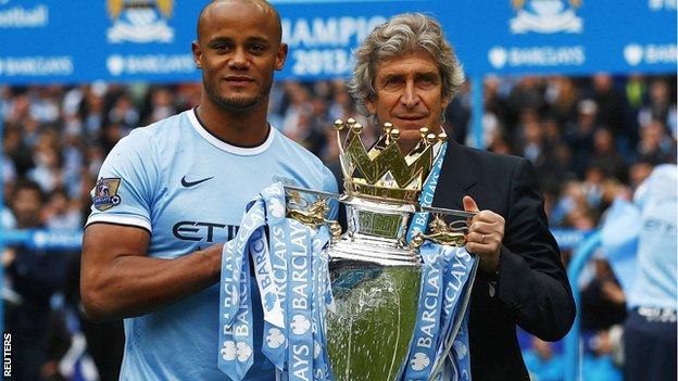 Manchester City captain Vincent Kompany and manager Manuel Pellegrini with the Premier League trophy