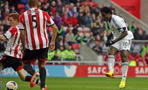 Swansea City top-scorer Wilfried Bony scores his side's third goal at the Stadium of Light.