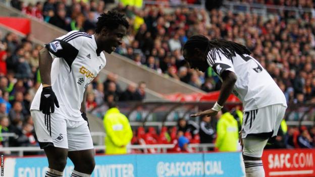 Bony celebrates his goal with fellow goalscorer Marvin Emnes as Swansea end the season with a 3-1 win.