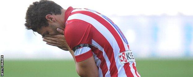 Atletico Madrid's Koke reacts following a missed chance against Malaga