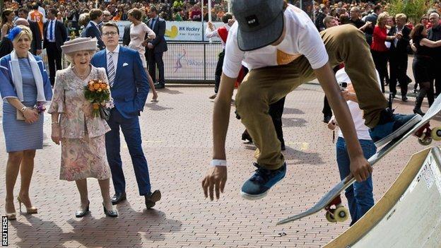 Princess Beatrix of the Netherlands, her son Prince Constantijn and his wife Princess Laurentien look at a skateboard demonstration during the first King"s Day in Amstelveen