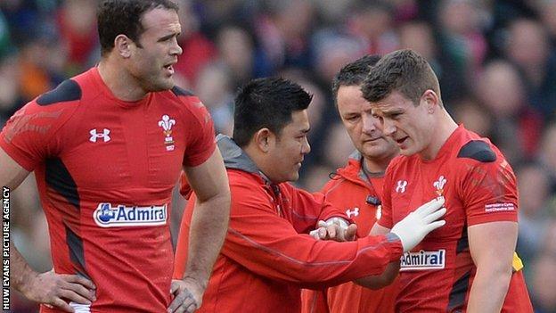 Scott Williams receives treatment after injuring his shoulder in the 2014 Six Nations match between Wales and Ireland