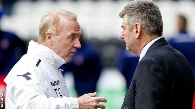 Tommy Craig in discussion with St Mirren chairman Tommy Gilmour