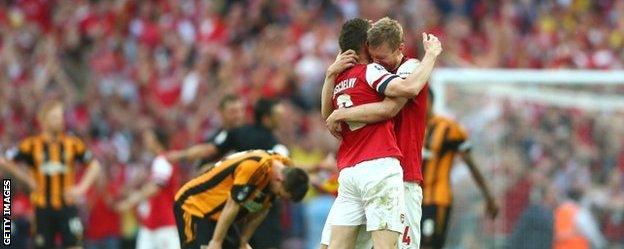 Arsenal's Laurent Koscielny and Per Mertesacker celebrate