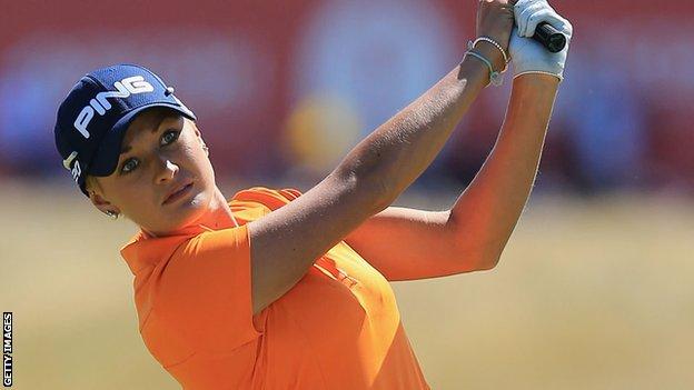 Welsh golfer Amy Boulden plays a shot in bright sunshine