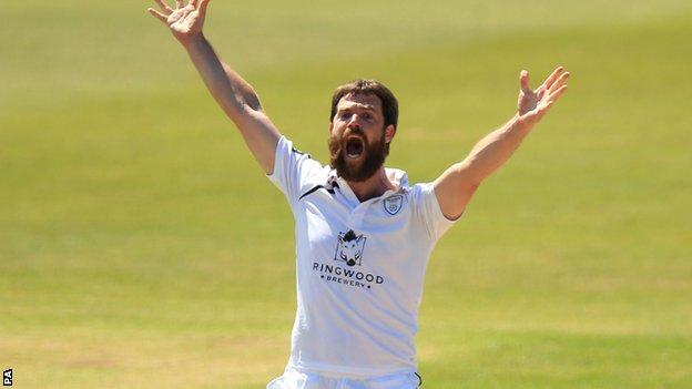 James Tomlinson takes a wicket for Hampshire