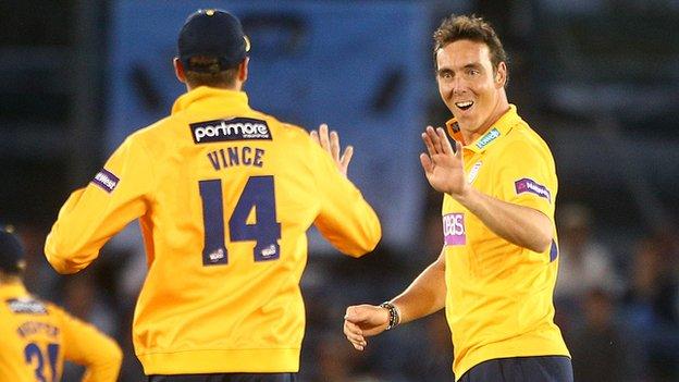 Kyle Abbott celebrates a Sussex wicket with Hampshire team-mate James Vince
