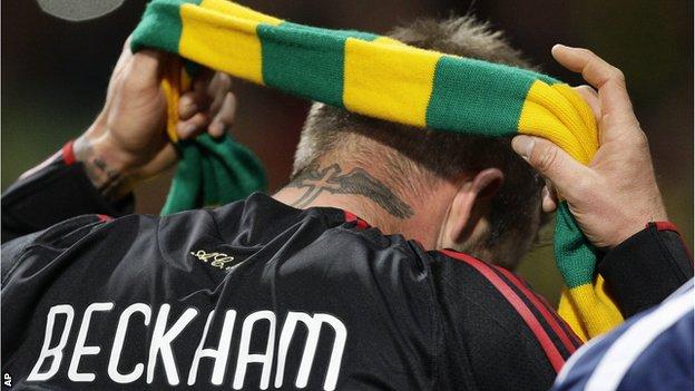 Former Manchester United player David Beckham donned a green and yellow scarf in support of the anti-Glazer protest when he returned to the club with AC Milan for a Champions League tie in 2010