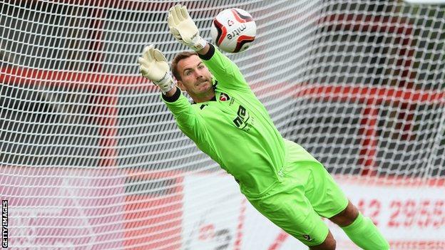 Scott Brown makes a save for Cheltenham