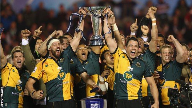 Victorious Northampton players lift the Amlin Challenge Cup after beating Bath