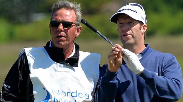 Bradley Dredge waits to play on the 16th fairway with his caddie during a second round 70 at the Nordea Masters at the PGA Sweden National.
