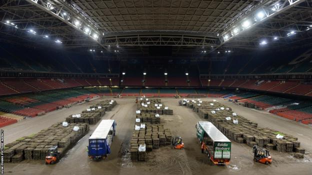 The Millennium Stadium pallets pitch is removed for the final time to make way for a new hybrid playing surface.