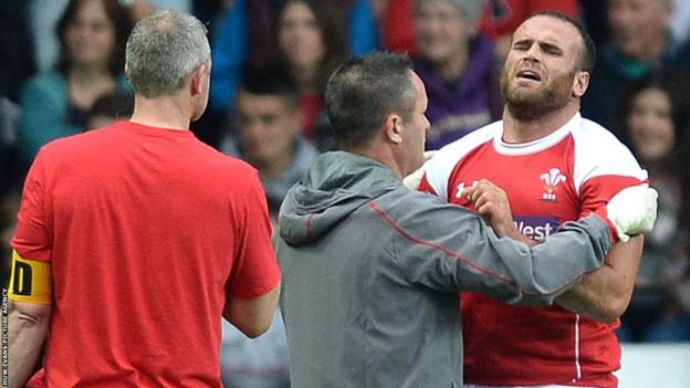 Centre Jamie Roberts gives Wales coach Warren Gatland a scare in the trial match as he leaves the pitch with a shoulder injury.