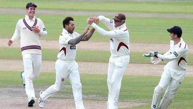 Peter Trego (second left) celebrates with his Somerset team-mates at Old Trafford