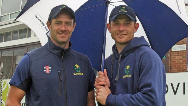 Dean Cosker and Graham Wagg of Glamorgan find shelter from the rain at Chelmsford on the final day of their County Championship match against Essex.