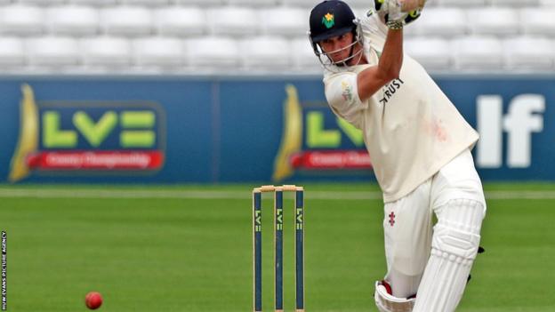 Glamorgan's Michael Hogan hits a boundary on the final day of the County Championship match against Essex in Chelmsford.