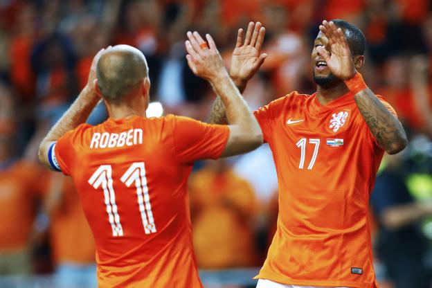 Arjen Robben congratulates Netherlands team-mate Jeremain Lens after his side take a 2-0 lead against Wales on Wednesday.
