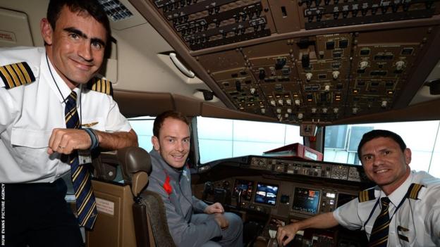 Wales captain Alun Wyn Jones sits at the controls of the team's plane before it takes off for the tour to South Africa.