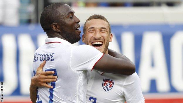 United States striker Jozy Altidore is congratulated by defender Fabian Johnson after scoring against Nigeria