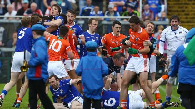 Players from both sides clash before the start of the Ulster SFC quarter-final at the Athletic Grounds