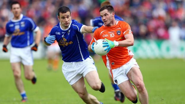Eugene McVerry and Alan Clarke in action during a keenly contested tie at the Athletic Grounds