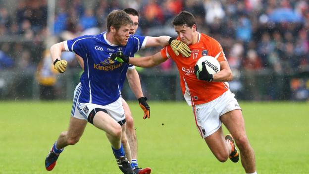 Cavan's Rory Dunne prepares to challenge Armagh's Stefan Campbell