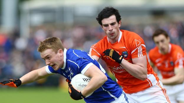 Turloc Mooney wheels away from Aaron Findon as Armagh progress to the Ulster SFC last four