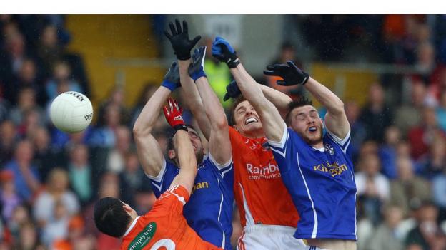 Armagh pair James Morgan and Charlie Vernon challenge for possession with Eugene Keating and David Givney