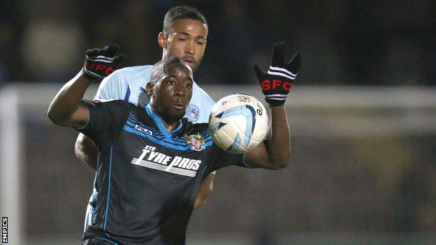 Stevenage's Lucas Akins controls the ball against Coventry