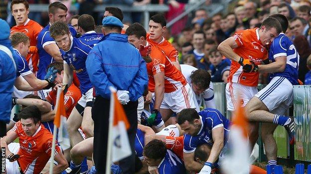 Young members of a band were ushered to safety as players of Armagh and Cavan fought before the match