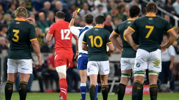 Wales centre Jamie Roberts is yellow carded for tackling Willie le Roux in the air