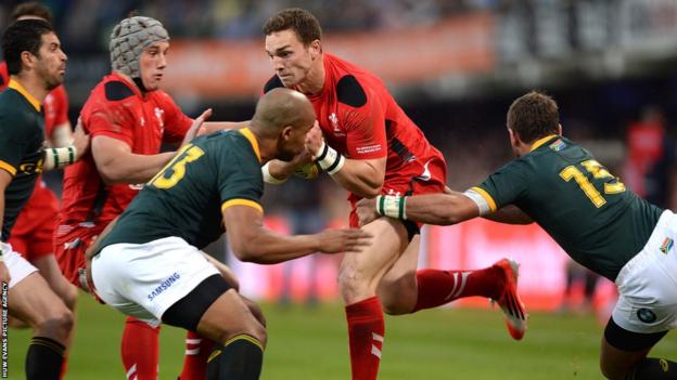 Wales wing George North, fit to start after illness, takes on South Africa’s JP Pietersen and Willie le Roux during the first Test in Durban.