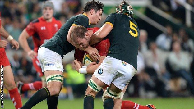 Alun Wyn Jones is tackled by South Africa’s Francois Louw and Victor Matfield