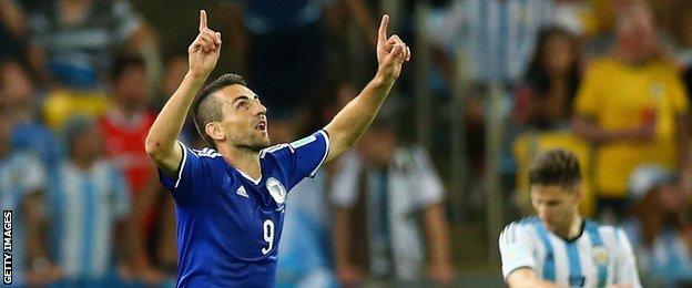 Vedad Ibisevic celebrates scoring Bosnia-Hercegovina's first goal in World Cup history