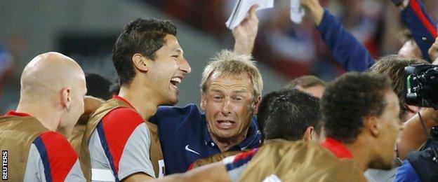 USA manager Jurgen Klinsmann celebrates his side's win over Ghana