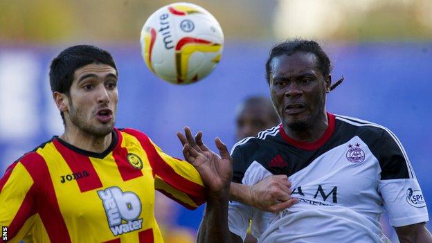 Gabriel Piccolo and Calvin Zola battle for possession during a match between Partick Thistle and Aberdeen