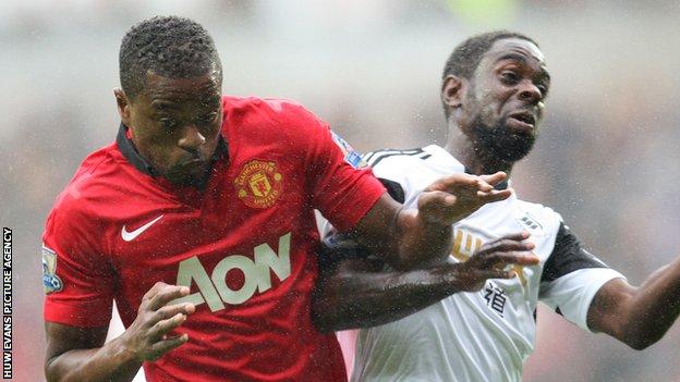 Patrice Evra of Manchester United and Nathan Dyer of Swansea City