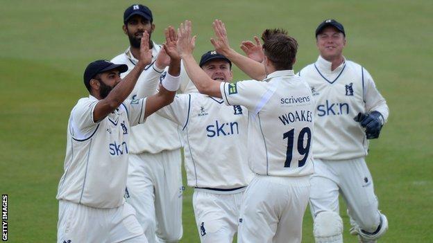 Warwickshire's players celebrate the fall of another Northants wicket at Wantage Road
