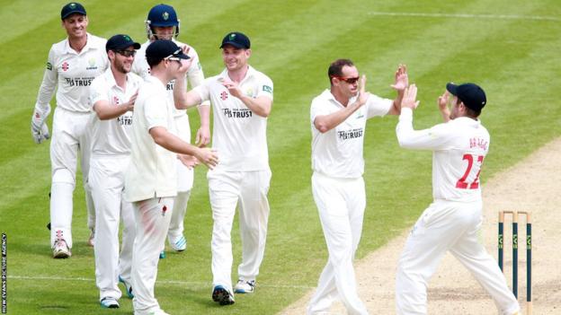 Glamorgan players celebrate taking the wicket of Kent's Mitchell Claydon as they wrap up victory in the County Championship before lunch on the final day in Cardiff.