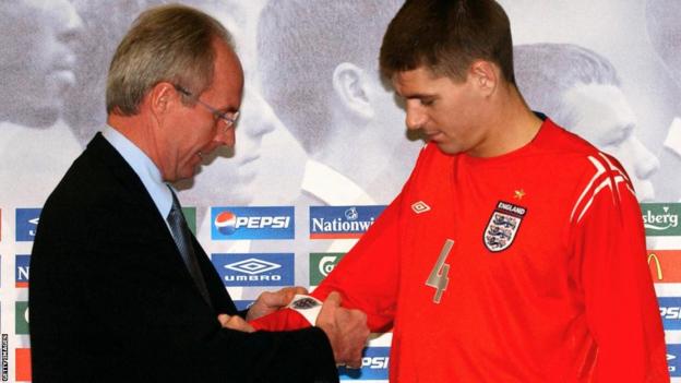 Sven Goran Eriksson puts the captain's armband on Steven Gerrard for the first time during a press conference on the eve of the friendly match against Sweden in Gothenburg in 2004